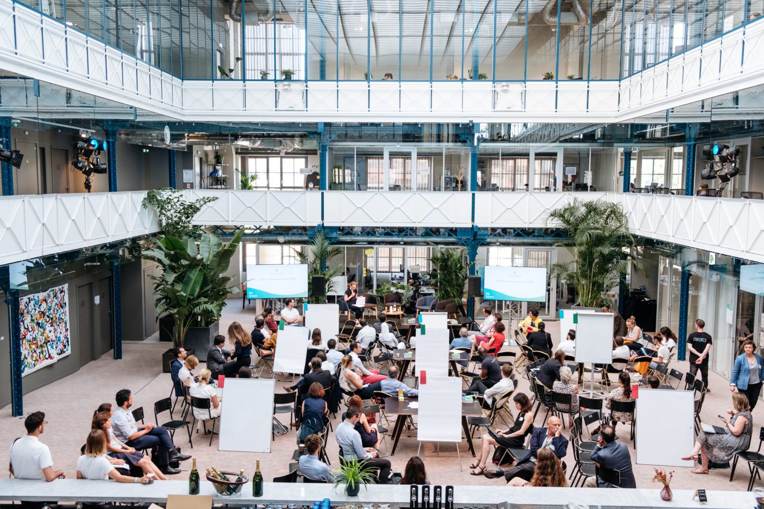 Speaker giving a talk in the atrium
