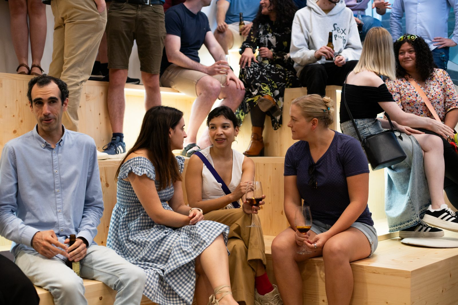 Audience on bleachers watching a talk