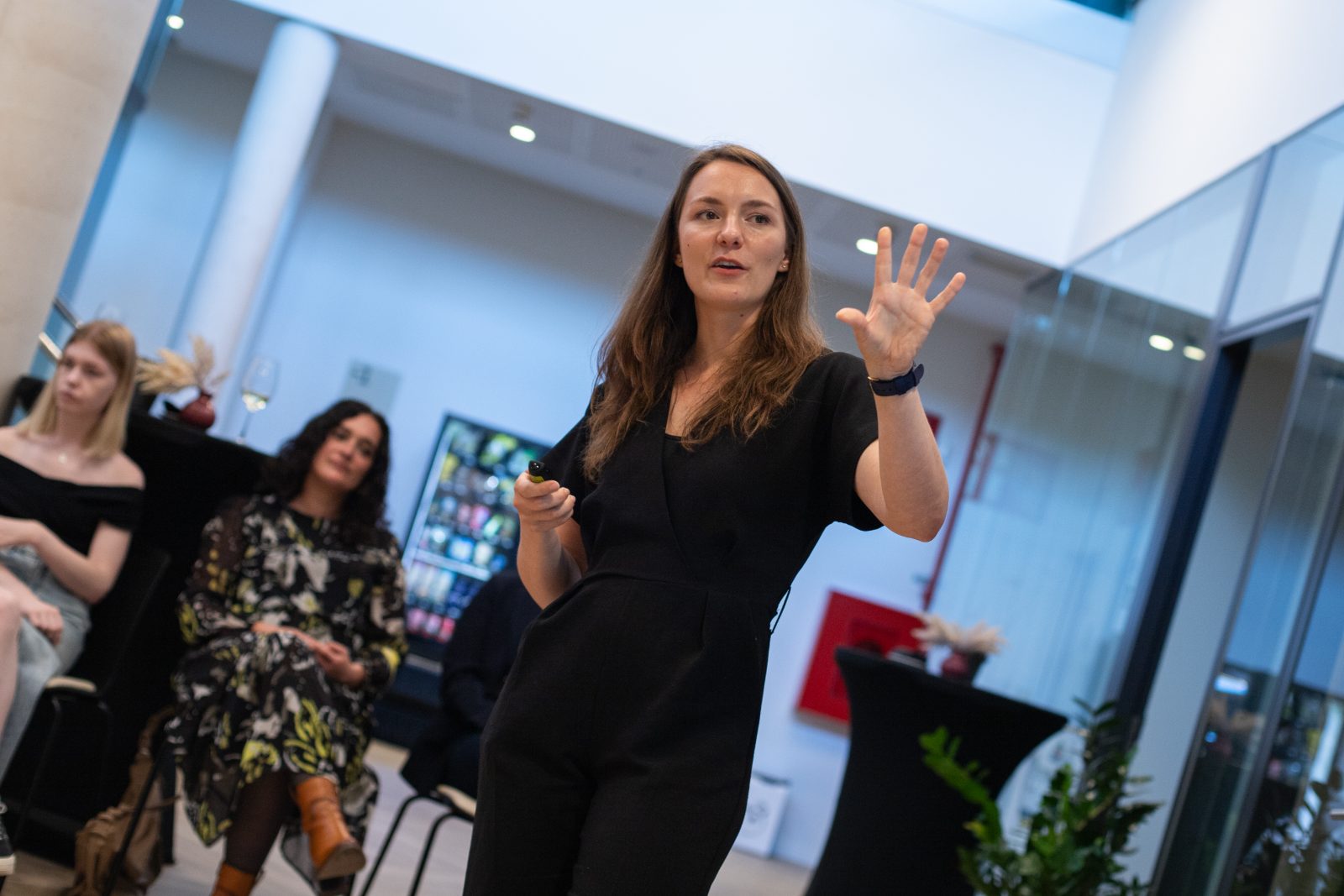 Speaker captured mid-gesture on stage