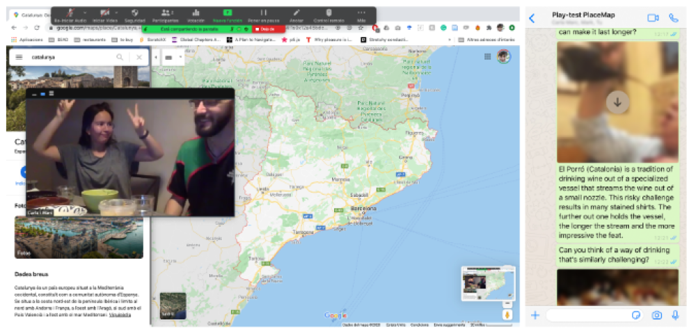 Two people are smiling at dinner while seeing a map centered on Barcelona, and instructions from the facilitator in Whatsapp to try the El Porró tradition, consisting of drinking wine out of a vessel that streams the wine out of a small nozzle.